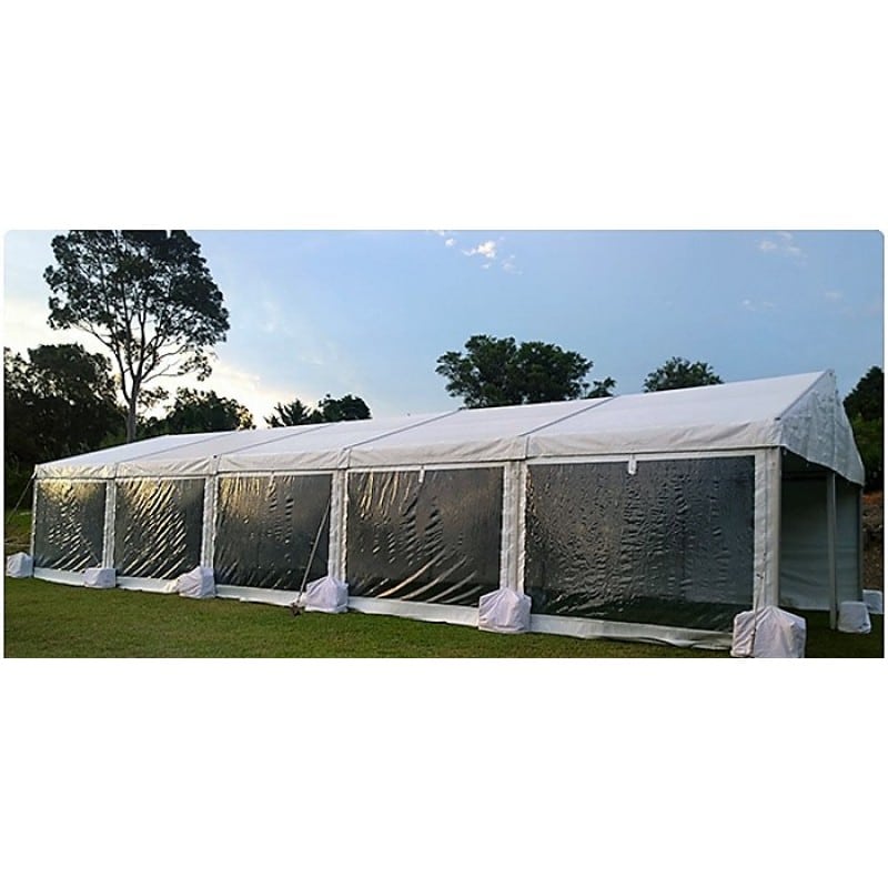 Happy Marquee Hire structure marquee with clear walls set up on grass